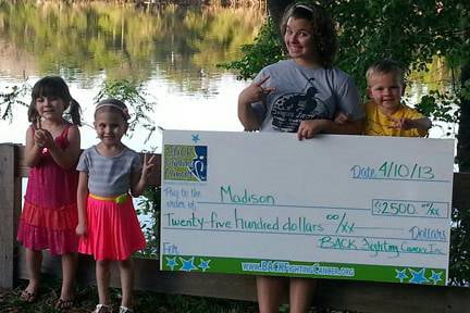 The BACK Fighting Cancer Giving our a check to a family