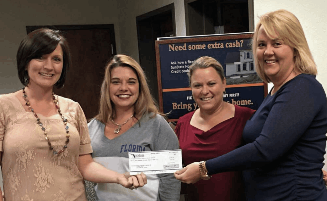 BACK Fighting Cancer  Board Members receive a check from Sun State Bank